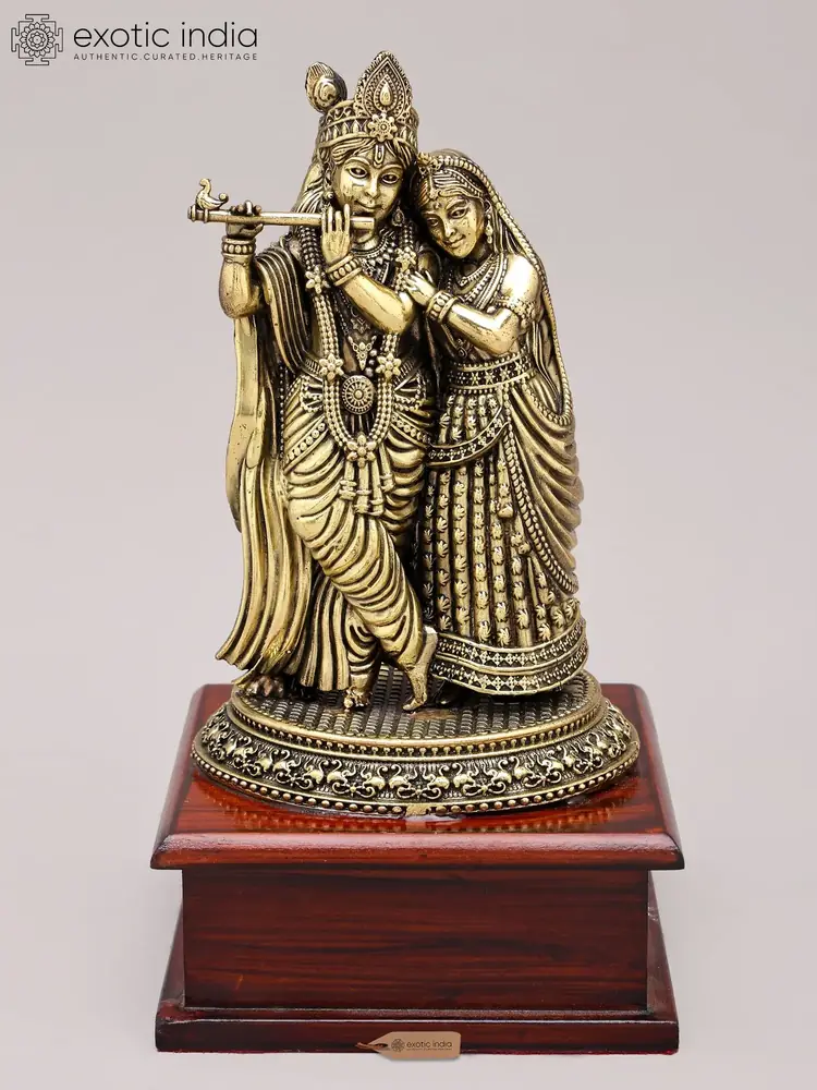 Brass Radha and Krishna on a wooden base, front view