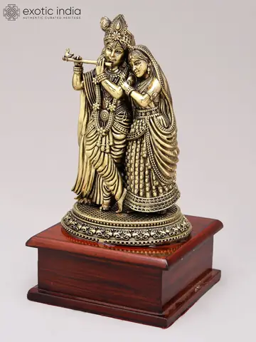 Figures from a slight angle on the wooden base