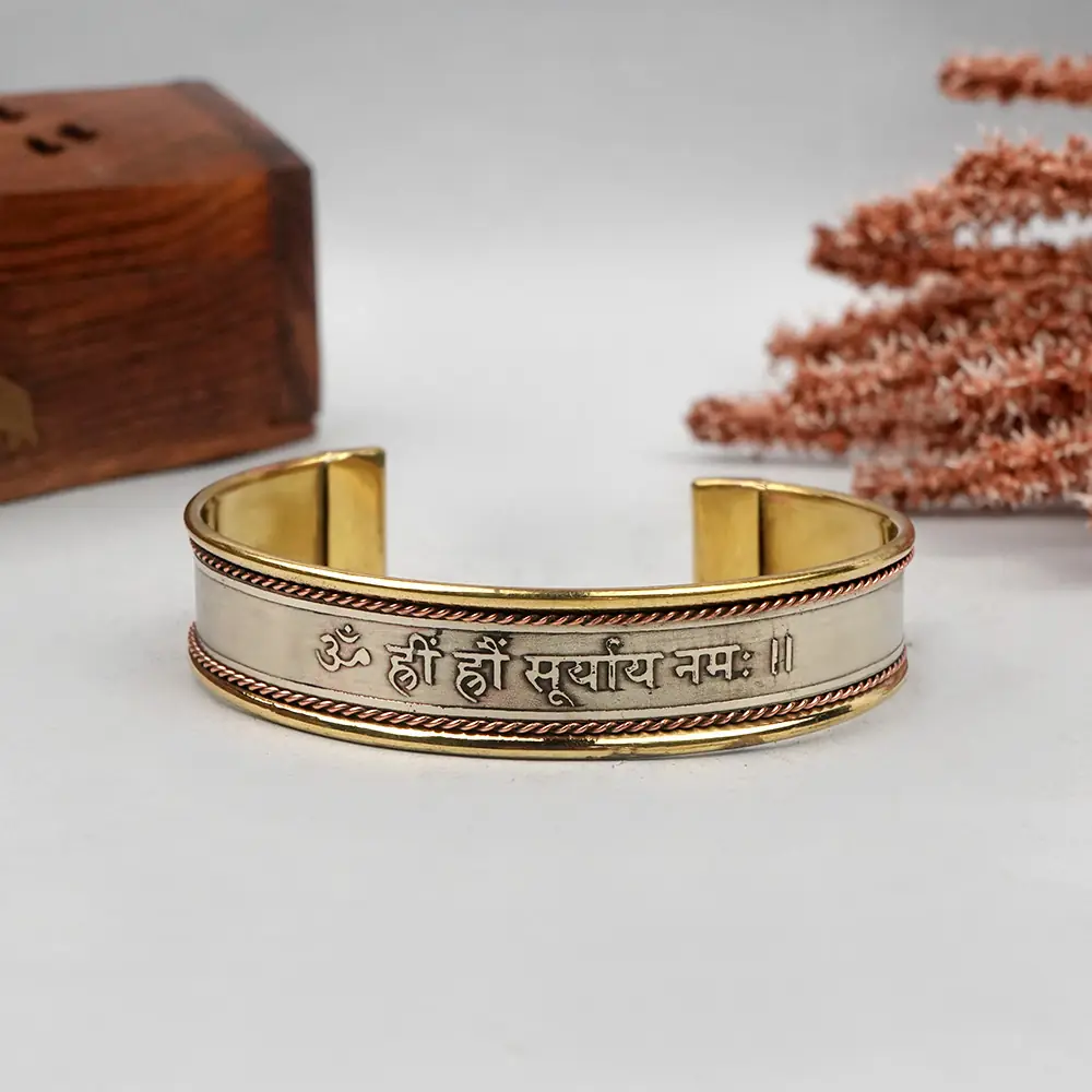 Front of the kada showing the engraved Surya mantra