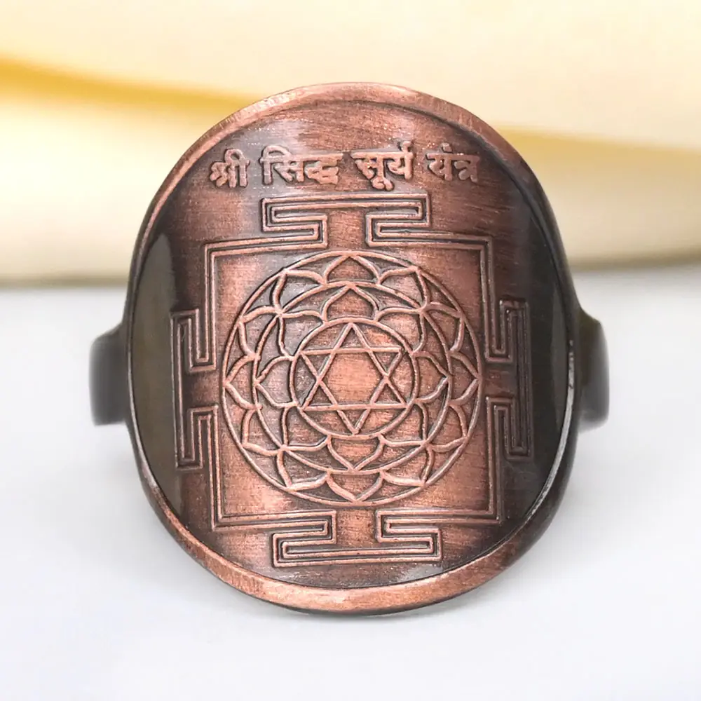 Copper ring with the Surya yantra engraved on its face