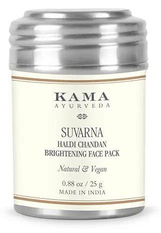 White jar of Kama Suvarna haldi chandan face pack with a steel lid