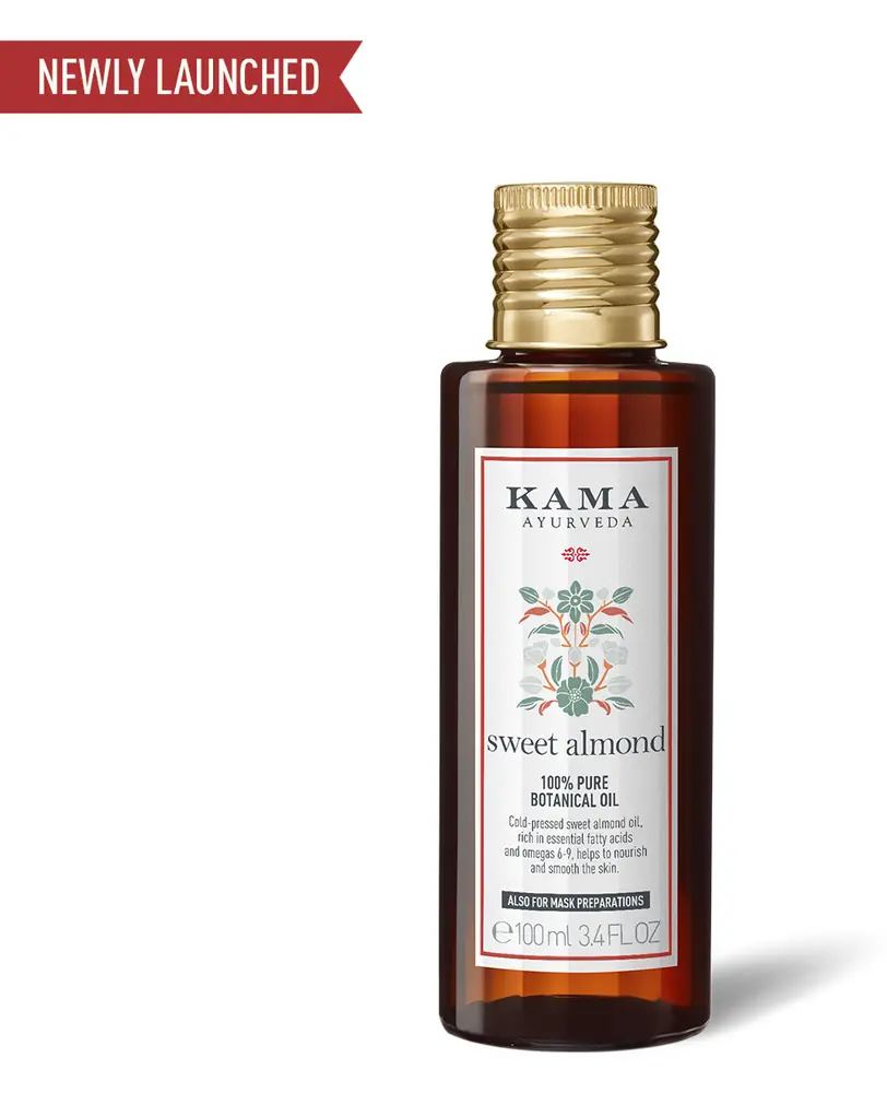 Bottle of Kama sweet almond botanical oil with a gold cap