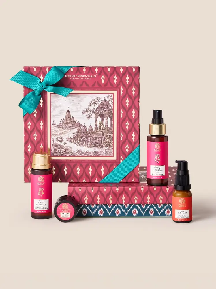 Red Tara gift box with a teal ribbon and four products