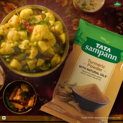Pouch beside a plate of vegetable curry