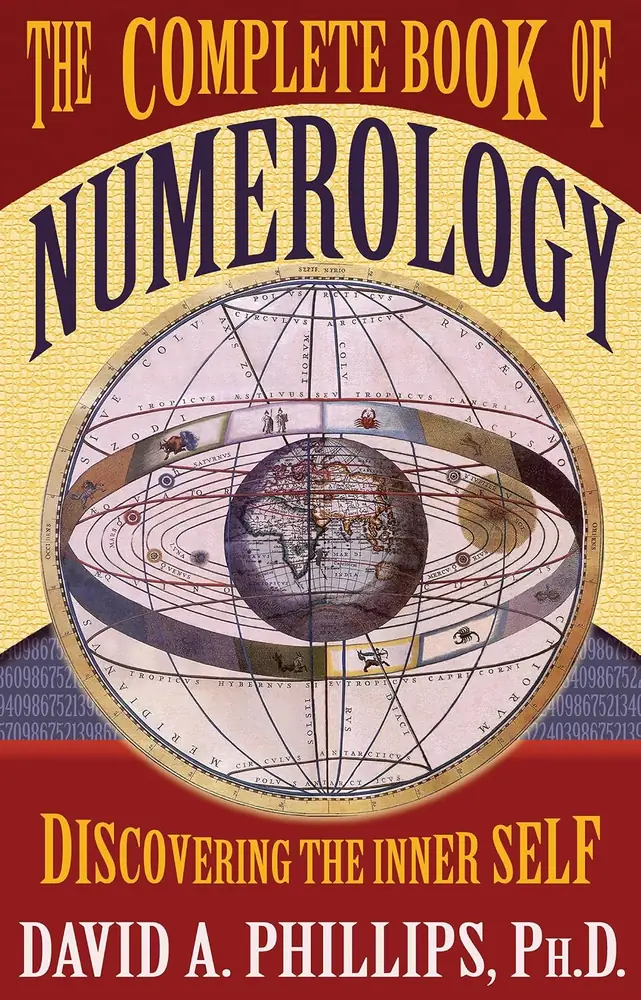 Front cover of The Complete Book of Numerology, red and gold with an armillary sphere design