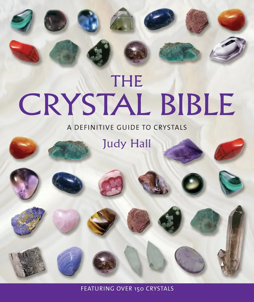 Cover of The Crystal Bible by Judy Hall with rows of polished stones