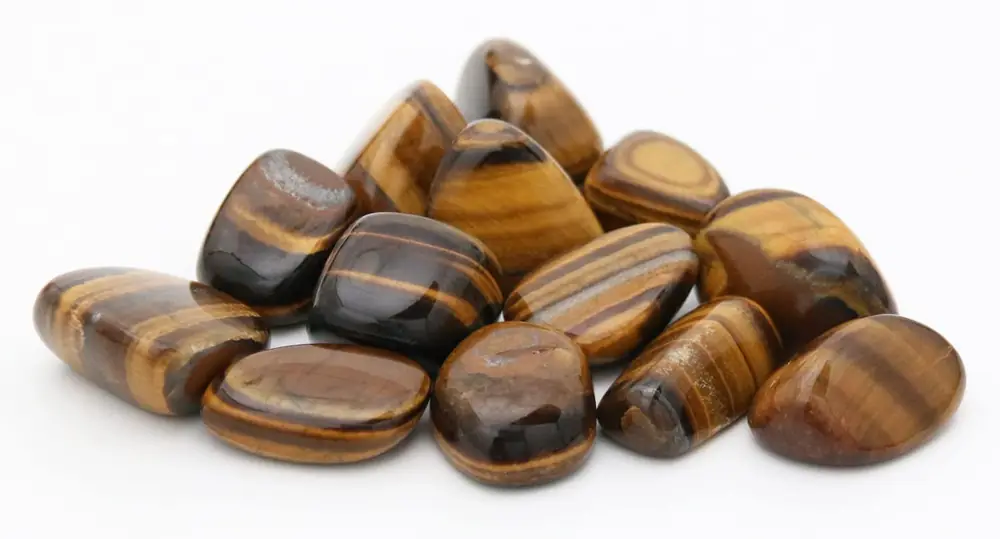 A heap of tumbled tiger's eye stones