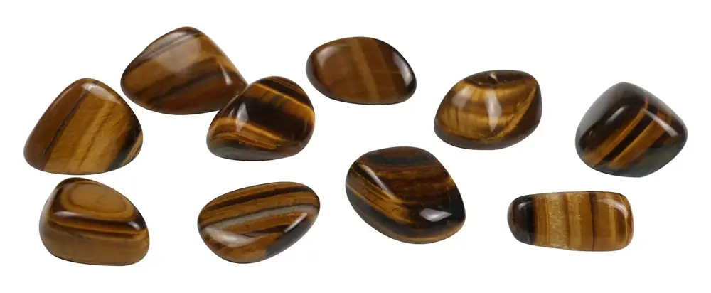 Tiger's eye stones spread out on white