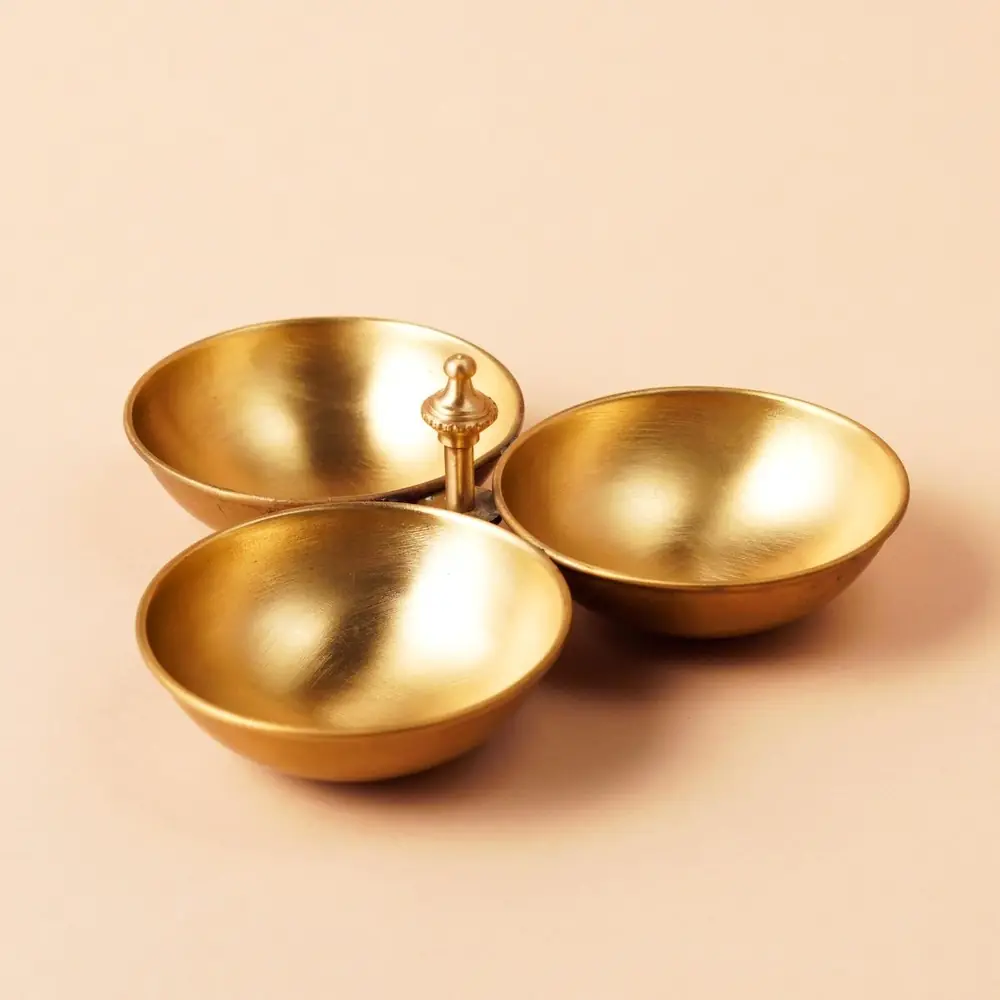 Three-bowl brass kumkum and turmeric holder