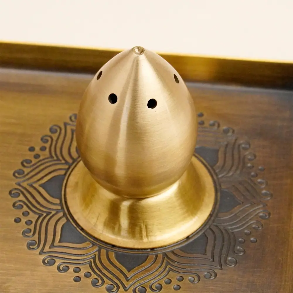 Close view of the perforated brass dome piece