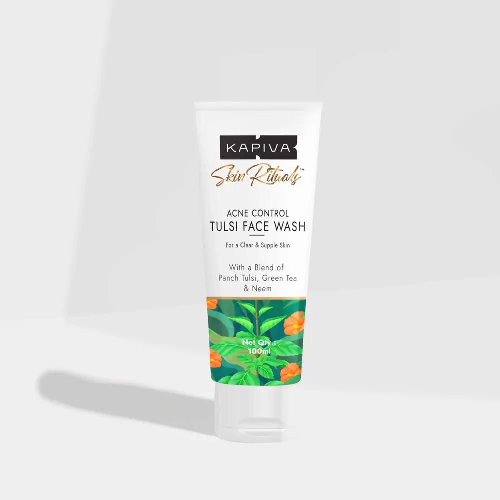 Tube of tulsi face wash on a grey ground