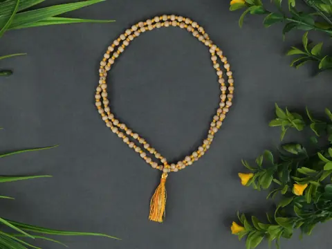 Ten tulsi malas laid side by side