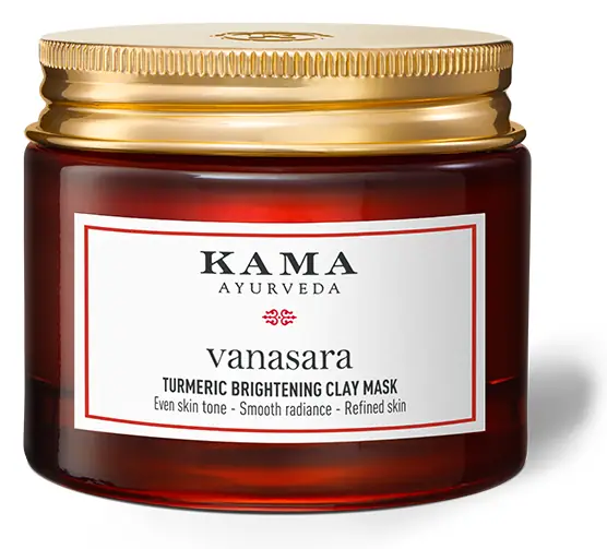 Red jar of Kama Vanasara turmeric clay mask with a gold lid