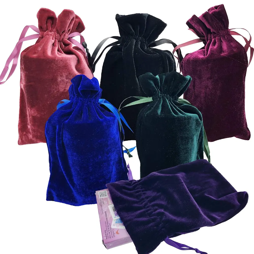 Six velvet drawstring bags in different colours piled together
