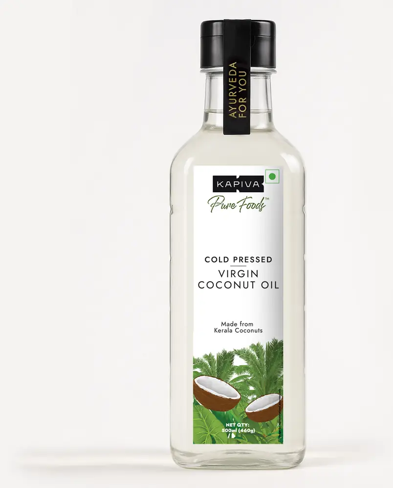 Bottle of virgin coconut oil on a grey ground