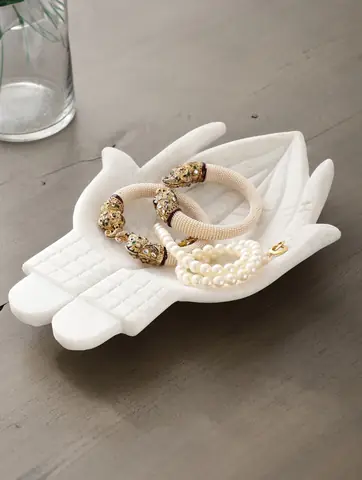 The dish with a gold spoon and sweets