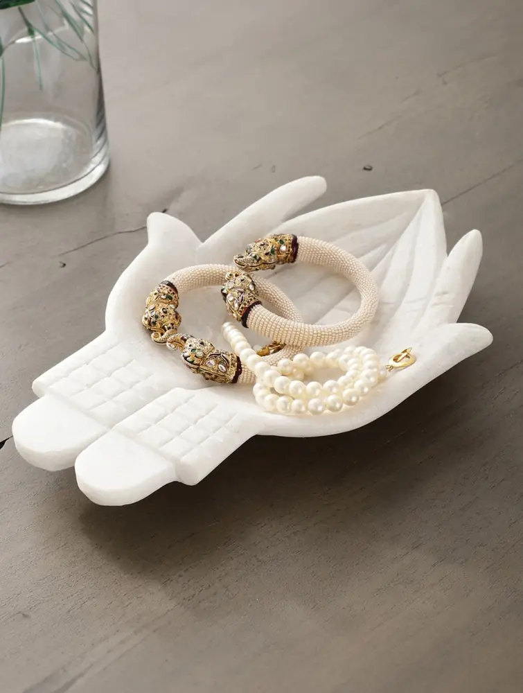 The dish with a gold spoon and sweets