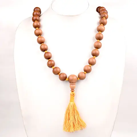 The mala on a white display bust
