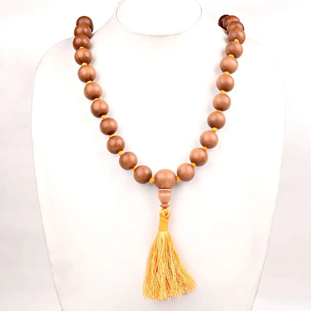 The mala on a white display bust