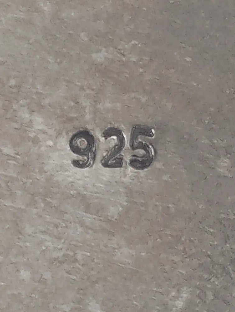 The 925 mark stamped on the silver