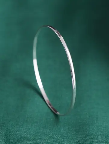 One slim bangle standing on its edge