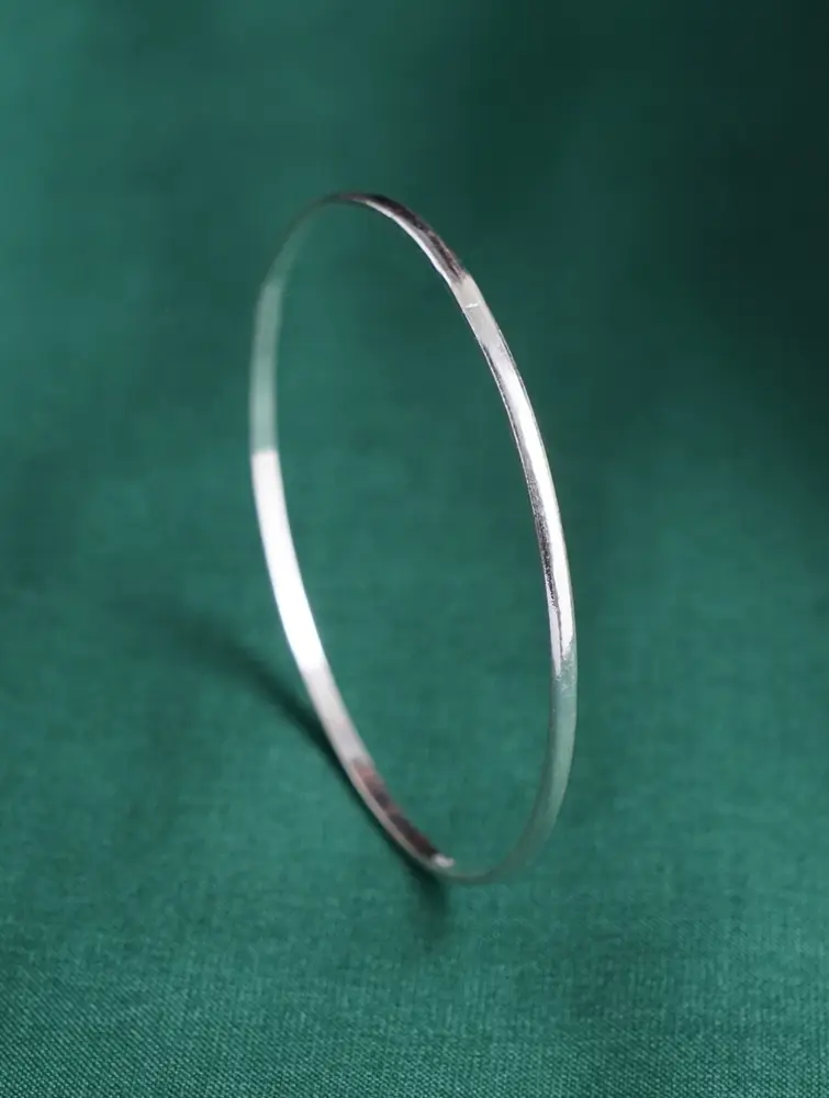 One slim bangle standing on its edge